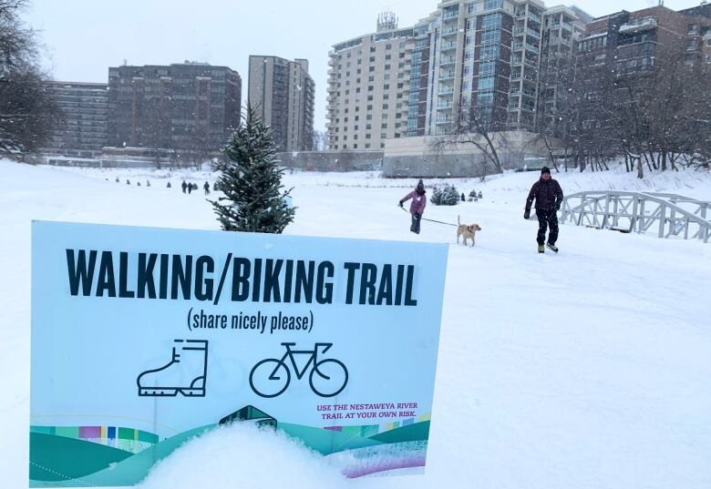 People skate and ski on the river trail.