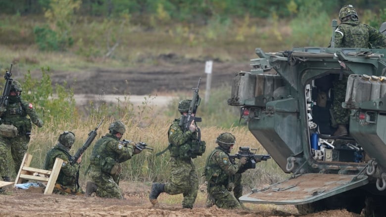 Canadian soldiers take part in NATO military exercises at a training ground in Kadaga, Latvia, on Sept. 13, 2021. NATO responded to Russia's 2014 annexation of Crimea by bolstering its forces near Russia and conducting drills on the territory of its Baltic members  manoeuvres the Kremlin has described as a security threat.