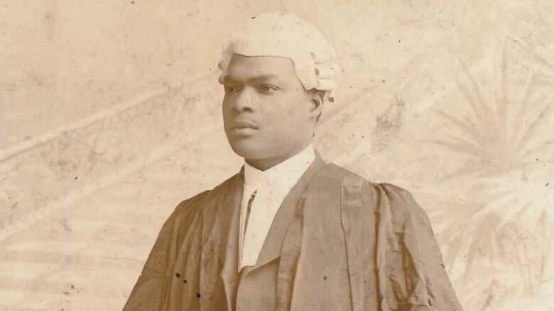 A old photo of a Black man wearing a white wig and robes