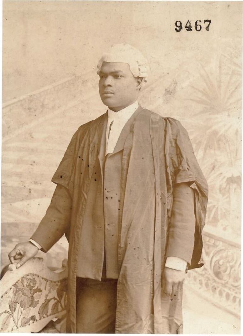 A old image of a Black man wearing a white wig and robes