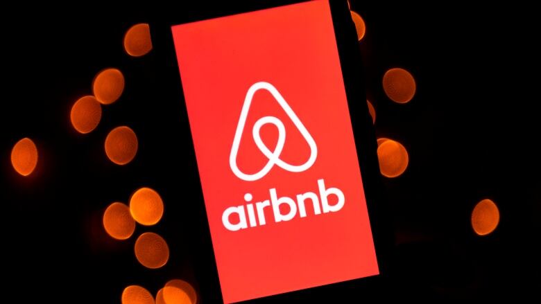 This illustration picture taken on November 22, 2019, shows the logo of the online lodging service Airbnb displayed on a smartphone in Paris.