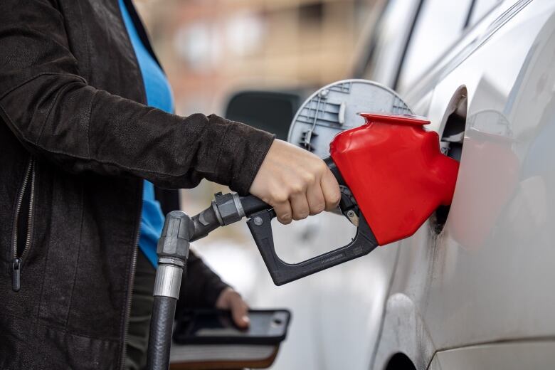 A gas pump in a car.