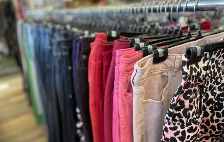 Pants on a store rack.