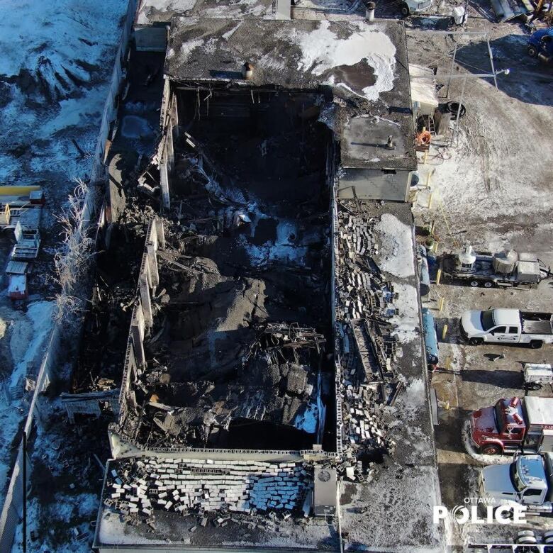 An overhead shot of a large rectangular outdoor site filled with rubble.