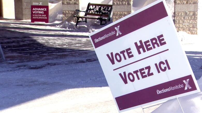 A sign that says 'vote here.'