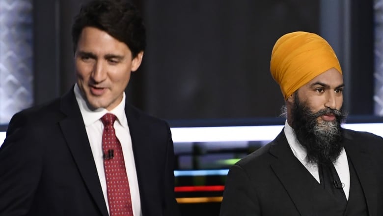 Liberal Leader Justin Trudeau, left, and NDP Leader Jagmeet Singh, prepare for the start of the federal election English-language Leaders debate in Gatineau, Que., on Thursday, Sept. 9, 2021.