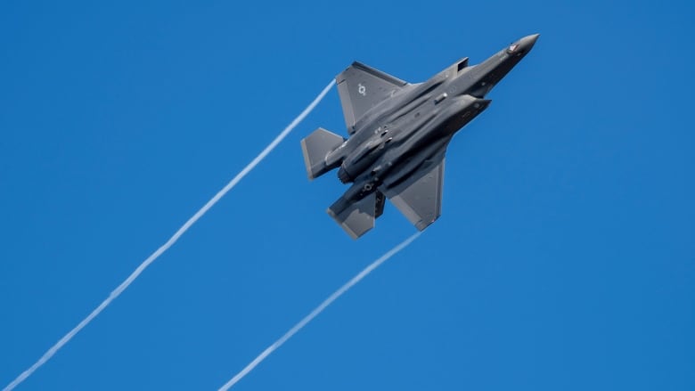 A U.S. F-35 fighter jet flies over the Eifel Mountains near Spangdahlem, Germany, Wednesday, Feb. 23, 2022. The U.S. Armed Forces moved stealth fighter jets to Spangdahlem Air Base a few days ago. The aircraft, built by the U.S. company Lockheed-Martin, is considered the most modern stealth fighter aircraft in the world.