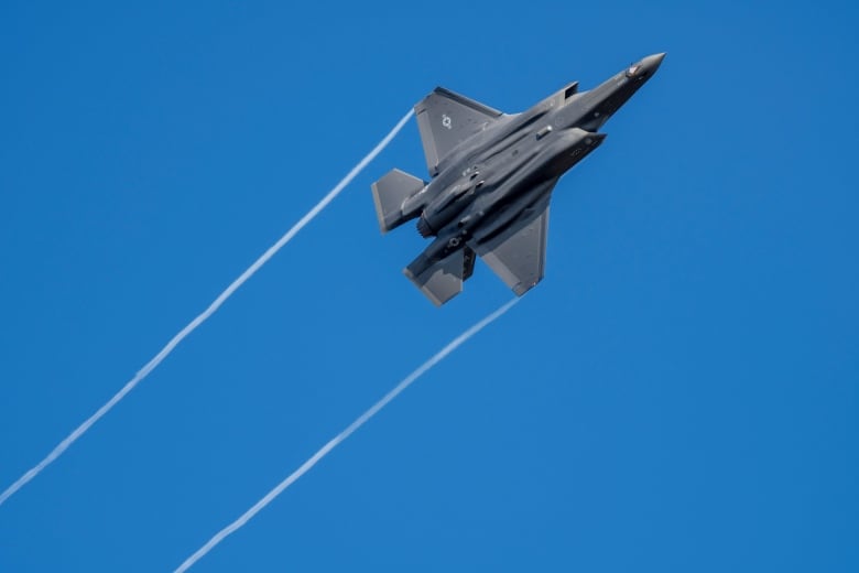 A U.S. F-35 fighter jet flies over the Eifel Mountains near Spangdahlem, Germany, Wednesday, Feb. 23, 2022. The U.S. Armed Forces moved stealth fighter jets to Spangdahlem Air Base a few days ago. The aircraft, built by the U.S. company Lockheed-Martin, is considered the most modern stealth fighter aircraft in the world.