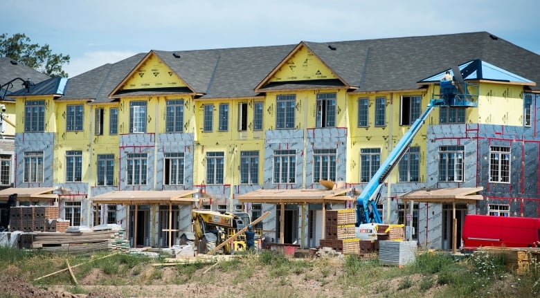 Exterior shot of townhomes under construction