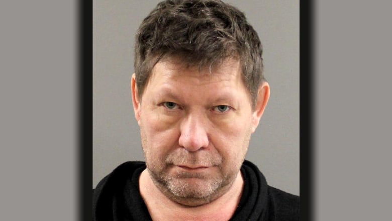 Mug shot of a man with short brown hair