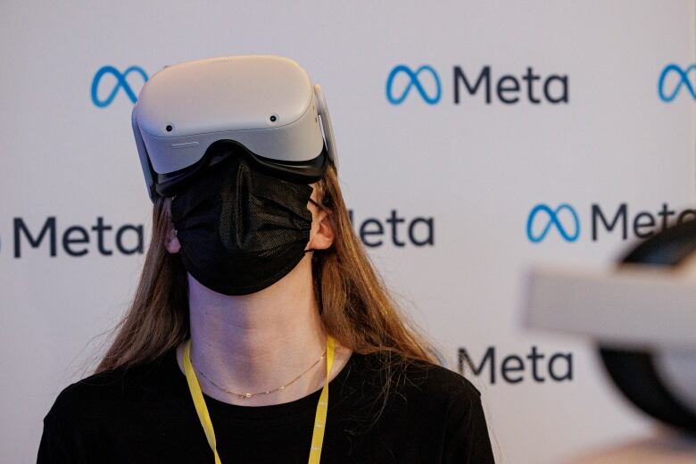 A person wears a virtual reality headset.