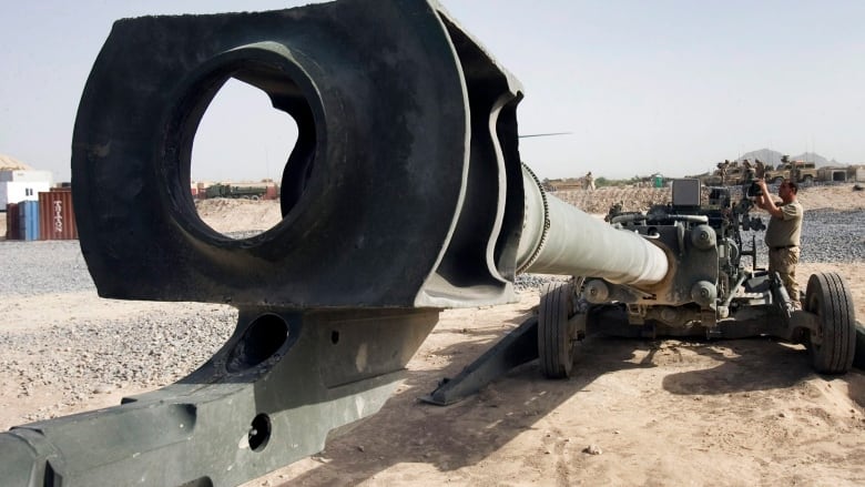 The barrel of an artillery piece points toward the viewer.