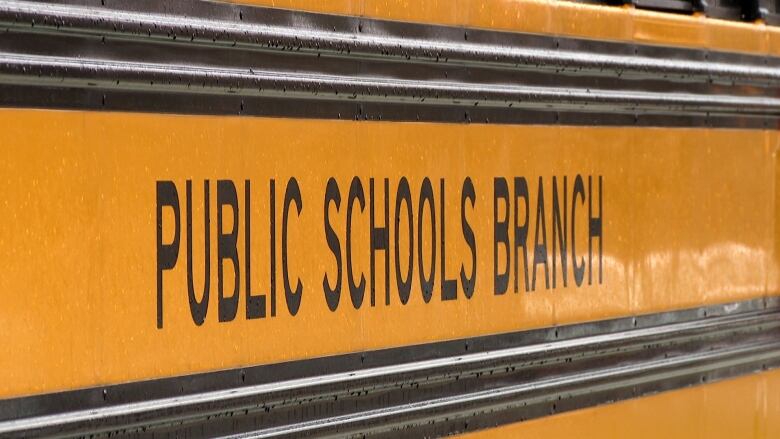 A close up of a Public Schools Branch bus. 