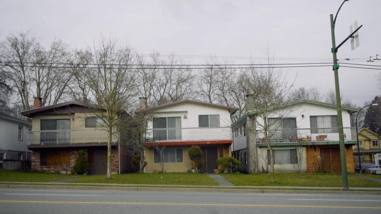 A row of single-family Vancouver Special homes.