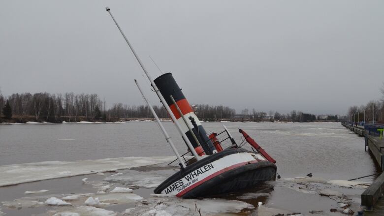 A sinking tug boat.