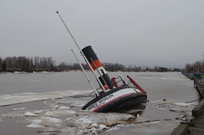 A sinking tug boat.