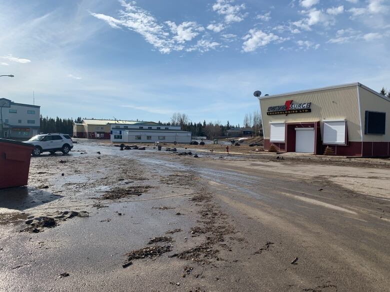 Wide, mud-covered street.