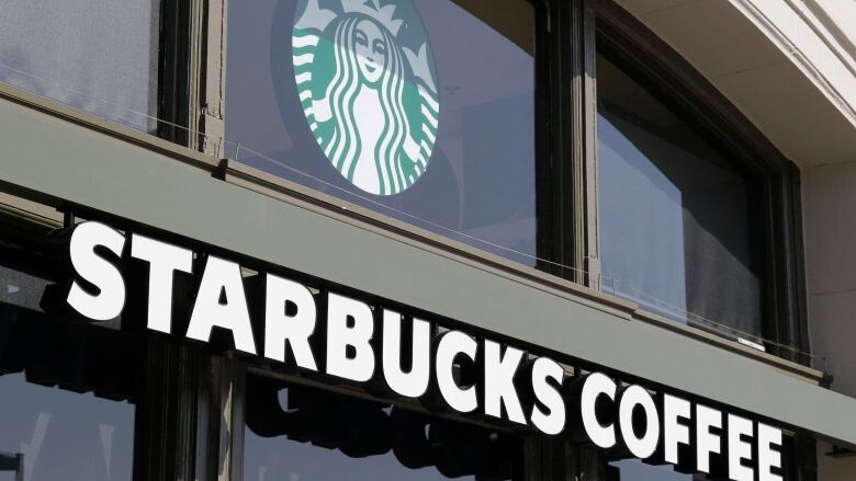 A Starbucks storefront is pictured, showing the logo and 'Starbucks' name.