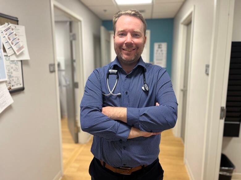 Dr. Padraig Casey in the hallway of his office.