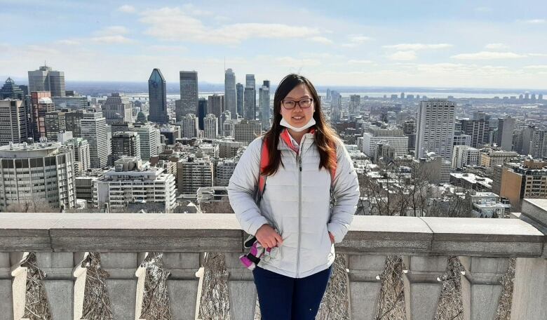 Nydia is seen standing at a lookout point on Mount Royal in Montreal.