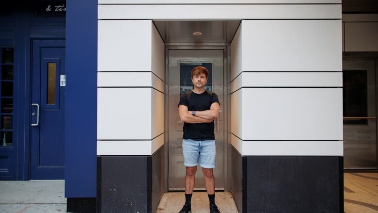 Peter Knegt, who organizes the Queer Cinema Club, stands for a portrait outside Paradise Theatre, in Toronto, on Jun. 9, 2022.