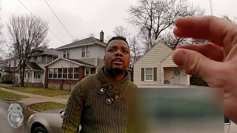 Police body camera footage of 26-year-old Patrick Lyoya moments before he was fatally shot during a police traffic stop in Grand Rapids Mich. on April 13, 2022. Officer Christopher Shurr has been charged with second-degree murder in Lyoya's death. 