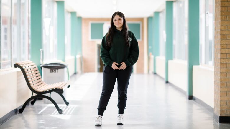 Ashki Shkur, a Grade 12 student at Britannia Secondary School in Vancouver, is pictured in a school hallway on June 10, 2022. 