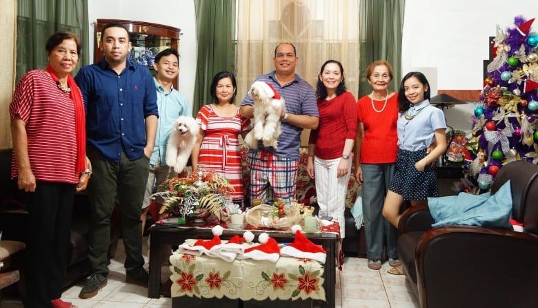 A Filipino family gathers for portrait at Christmas.