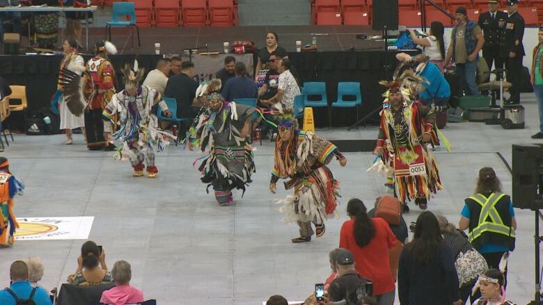 Indigenous dancers in full regalia are seen performing at the Mawitajik Competition Powwow at the Zatzman Sportsplex in Dartmouth, N.S.