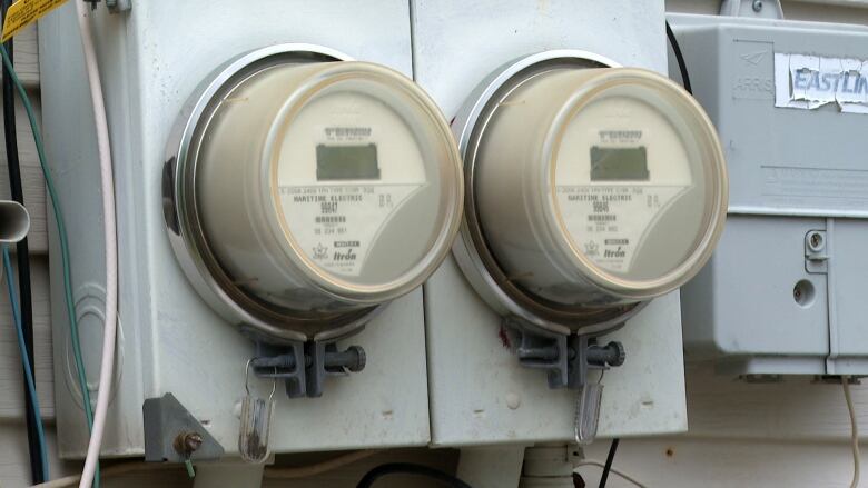 Two round electricity meters