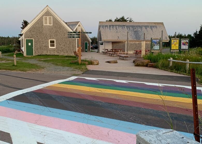 LGBTQ flag colours painted on a crosswalk