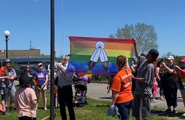 People raising a flag