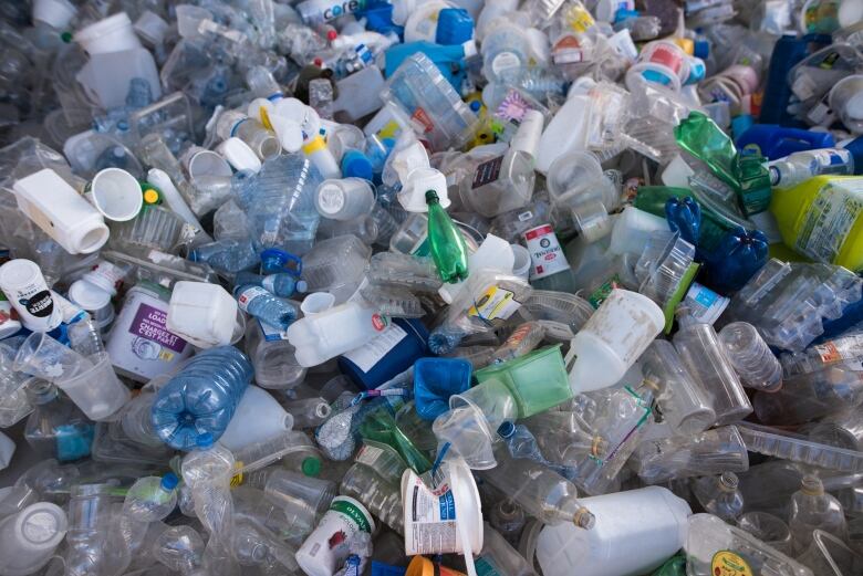 A closeup of empty plastic containers that are part of an art installation.