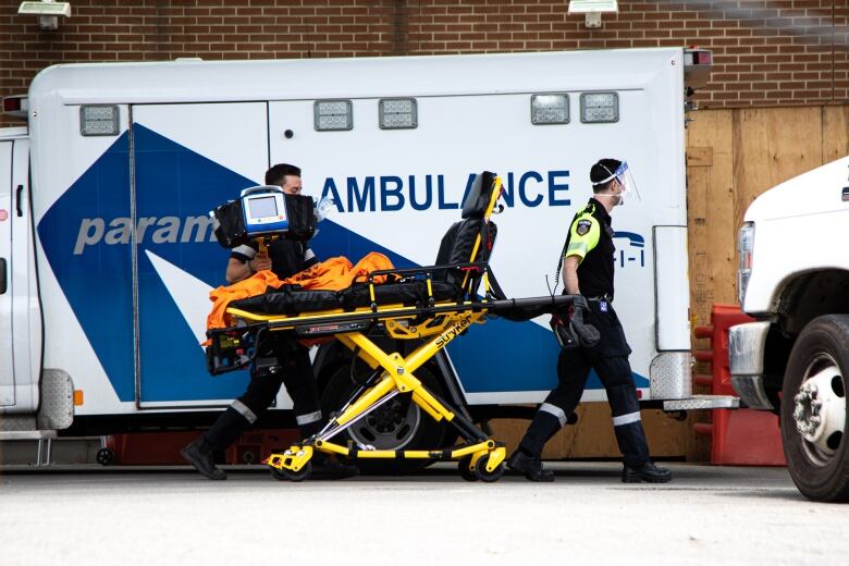 Paramedics are pictured outside the Toronto Western Hospital Emergency Department on Wednesday, June 15, 2022. 