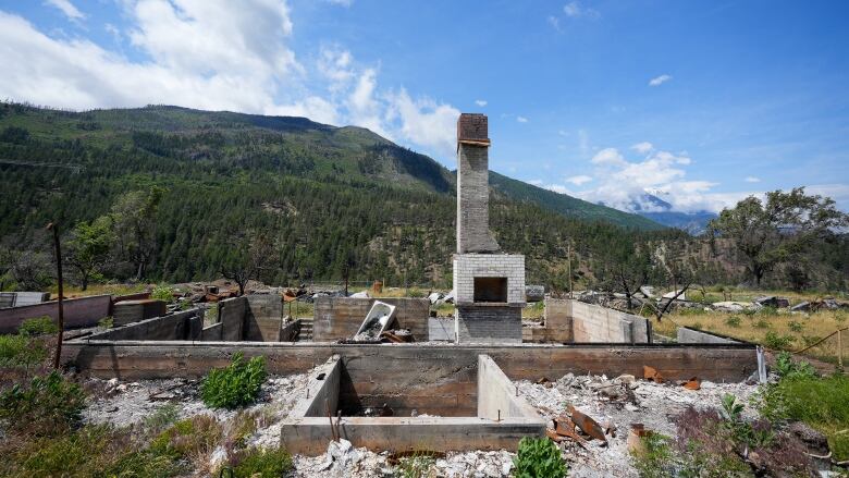 A chimney and foundation from what was once a home are all that is left after a wildfire tore through the town of Lytton, B.C.