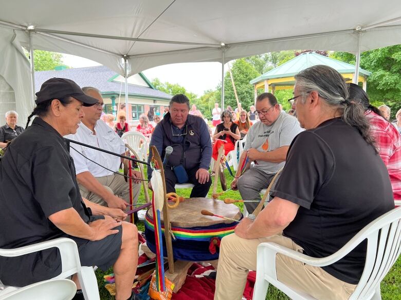 People take part in a drum circle.