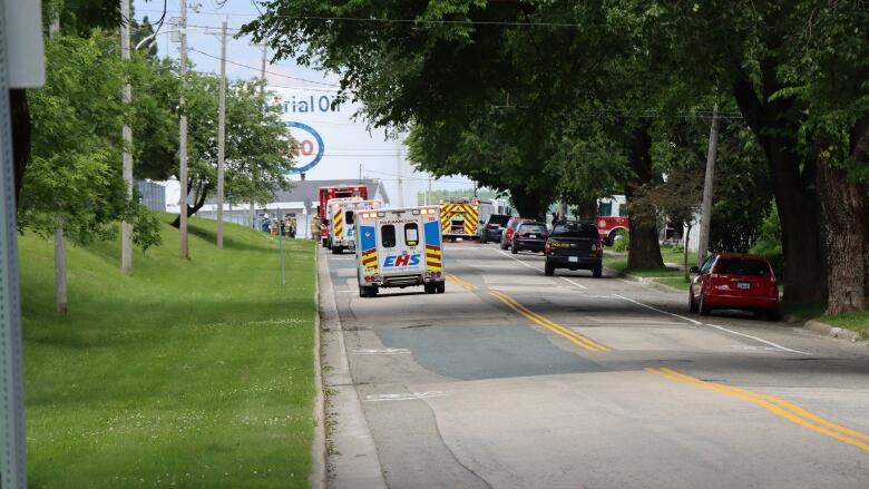 Emergency vehicles are seen on a road leading to the Imperial Oil terminal in Sydney, N.S.