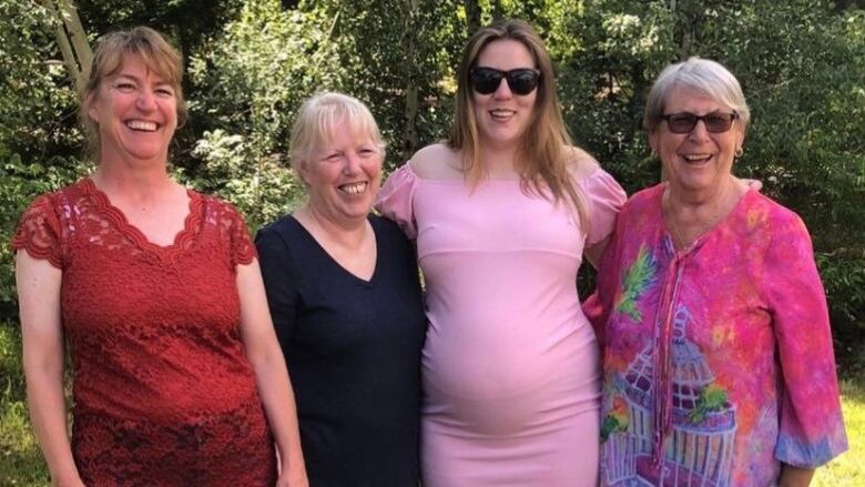 Four smiling women.