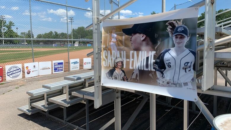 A poster of a girl playing baseball.