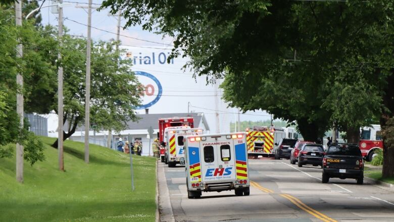 Emergency response vehicles parked on a street.