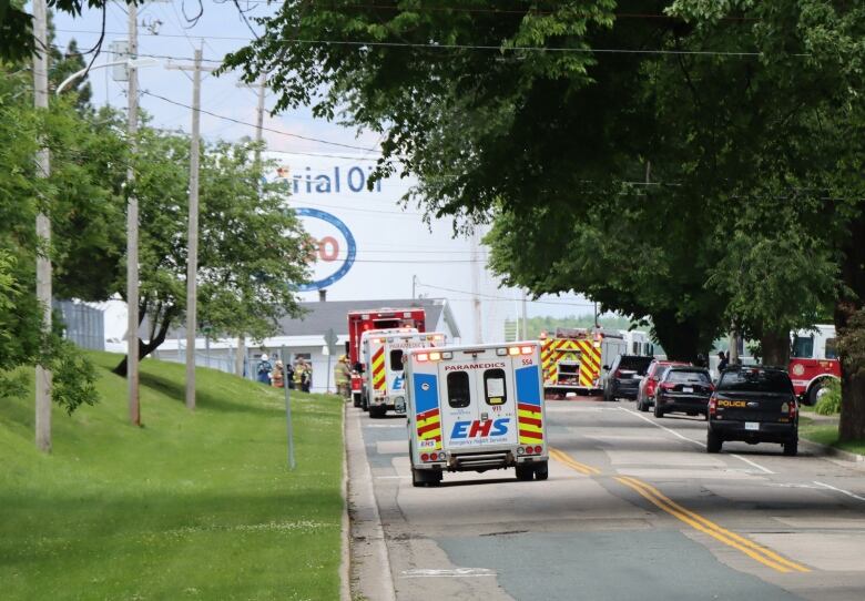 Emergency response vehicles parked on a street.