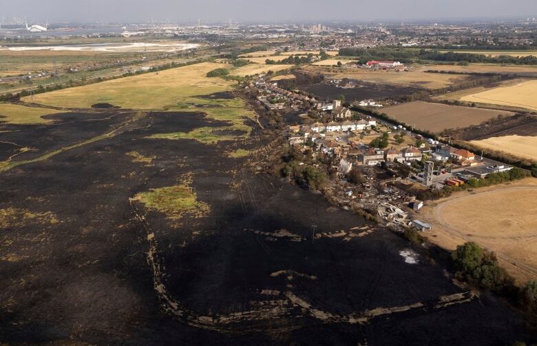 A scorched landscape is seen from the air. 