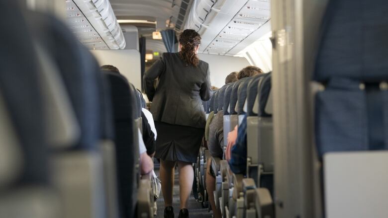 Flight attendants inside an Air Canada flight