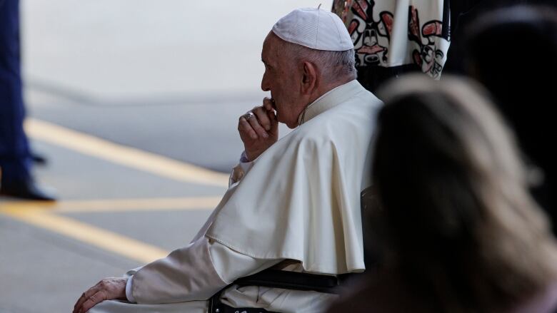 Pope Francis sits in his wheelchair at the Edmonton airport.