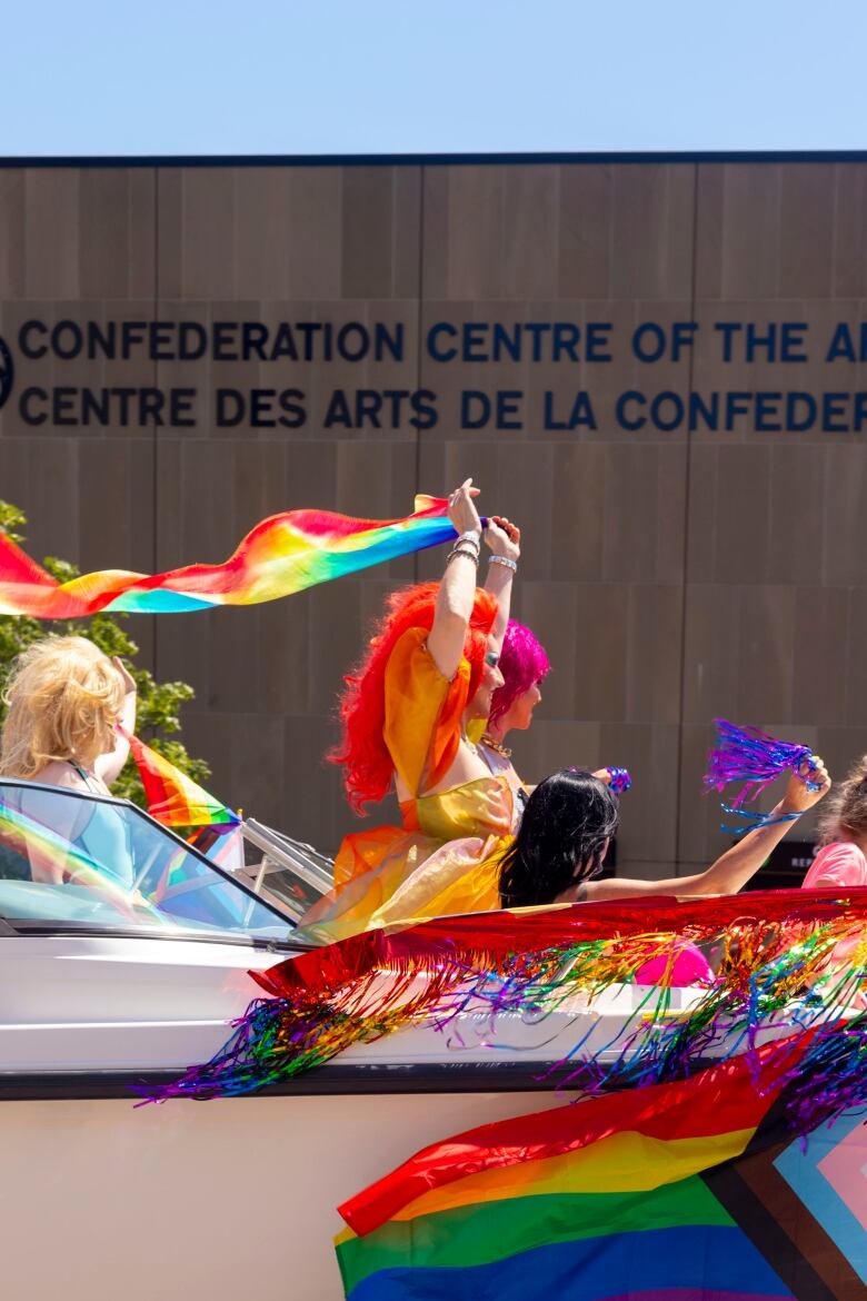 Drag queens in boat decorated at Pride Parade