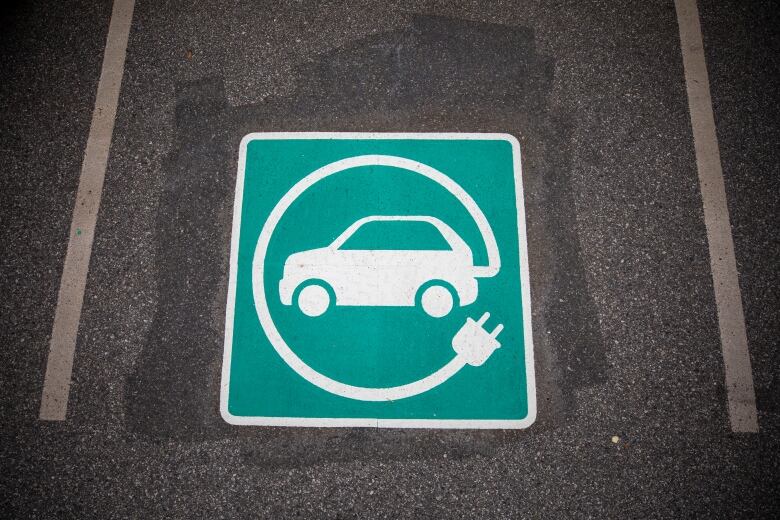 An electric vehicle charging space is pictured at a parking lot in Surrey, B.C.