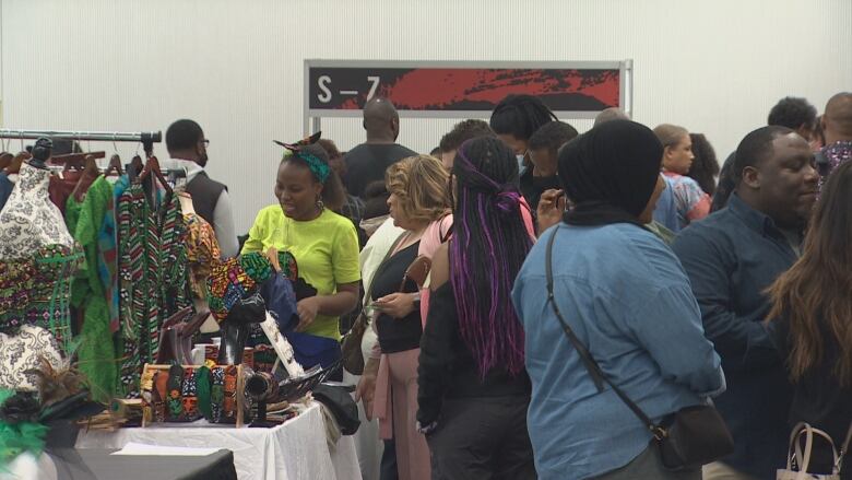 A group of people at an indoor marketplace