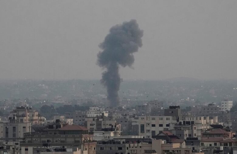 Smoke rises following Israeli airstrikes on a building in Gaza City, Friday, Aug. 5, 2022. 