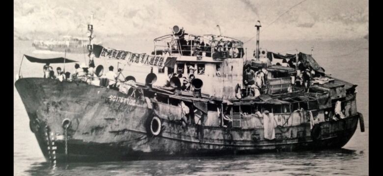 A black and white photo of a large boat.