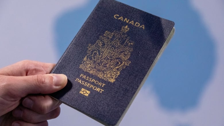 Photo of an ePassport is shown where a traditional passport book is embedded with an electronic chip containing information about the traveller.